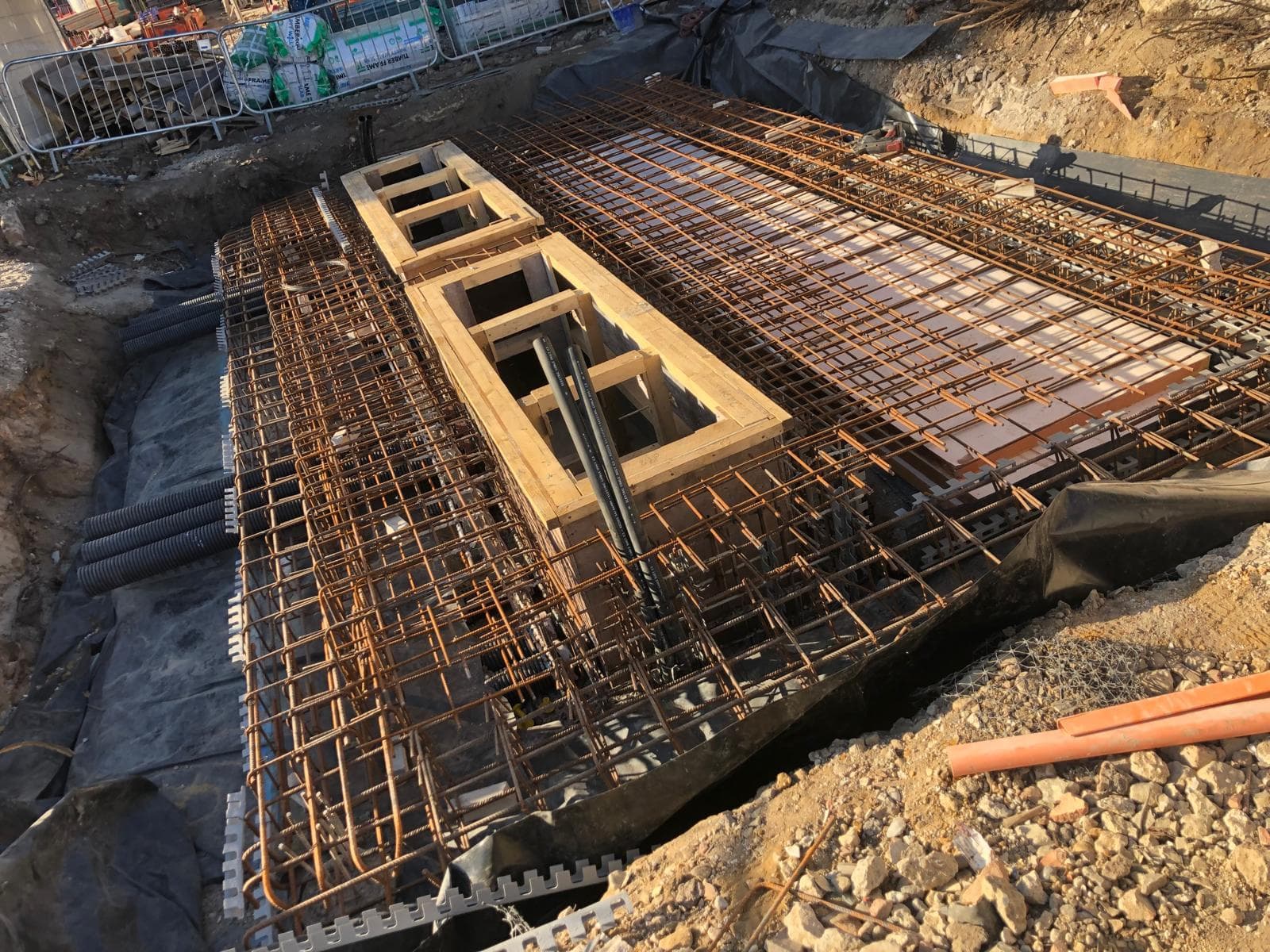 Reinforced concrete slab with rebar and drainage prep, Walton on Thames
